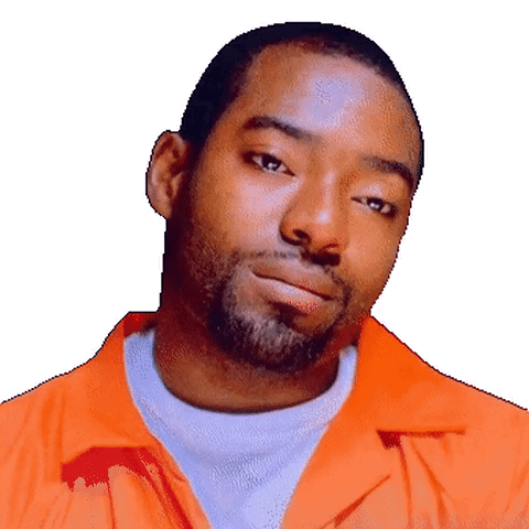 A Man With A Beard Wearing An Orange Shirt GIF