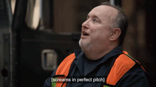 A Man With A Beard Wearing An Orange Vest Screams In Perfect Pitch GIF