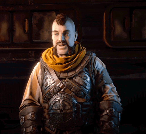 A Man With A Beard Wearing Armor And A Scarf Around His Neck GIF