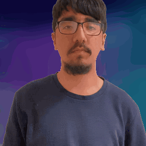 A Man With A Beard Wearing Glasses And A Black Shirt GIF