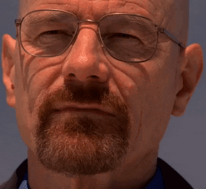 A Man With A Beard Wearing Glasses And A Blue Shirt GIF