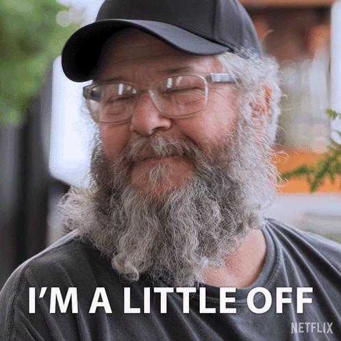 A Man With A Beard Wearing Glasses And A Hat Says I 'M A Little Off Netflix GIF