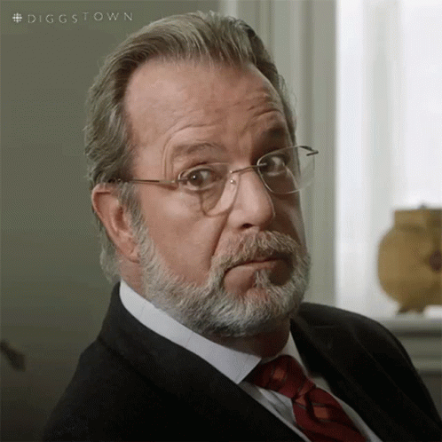 A Man With A Beard Wearing Glasses And A Tie GIF