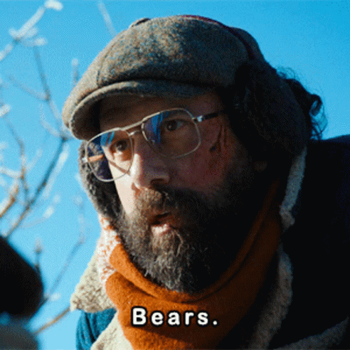 A Man With A Beard Wearing Glasses And Ear Muffs Says " Bears " GIF