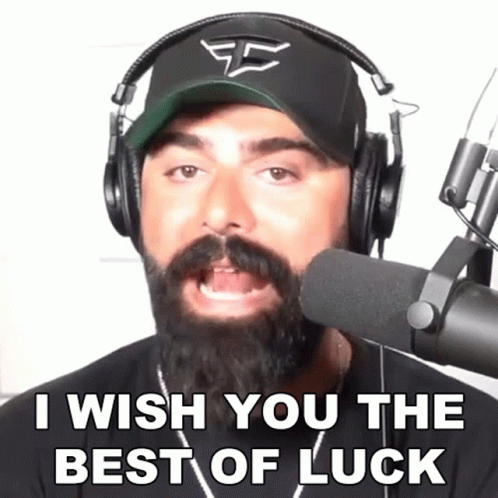 A Man With A Beard Wearing Headphones And A Hat Says I Wish You The Best Of Luck GIF