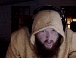 A Man With A Beard Wearing Headphones And A Hooded Sweatshirt GIF