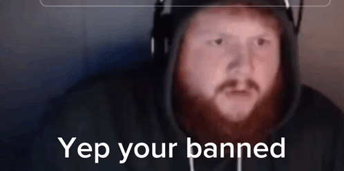 A Man With A Beard Wearing Headphones And A Hoodie With The Words Yep Your Banned On The Bottom GIF