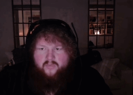 A Man With A Beard Wearing Headphones And A Microphone GIF