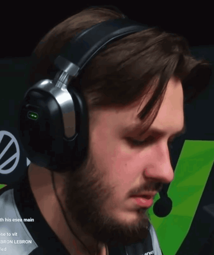 A Man With A Beard Wearing Headphones And A Microphone With The Word Lebron On It GIF