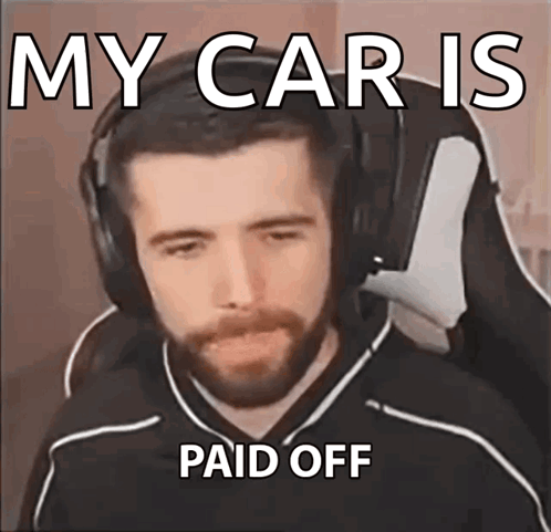 a man with a beard wearing headphones is making a meme about his car being paid off