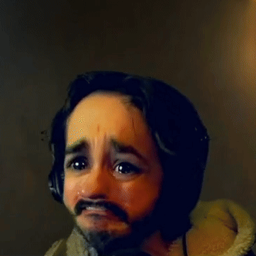 A Man With A Beard Wearing Headphones Making A Face GIF