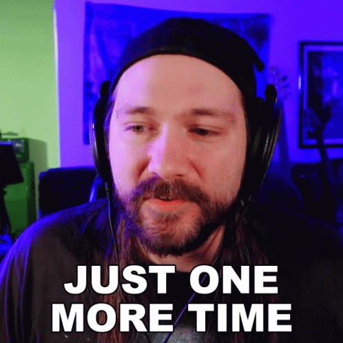 a man with a beard wearing headphones says " just one more time "