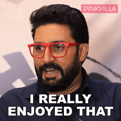 A Man With A Beard Wearing Red Glasses Says " I Really Enjoyed That " GIF