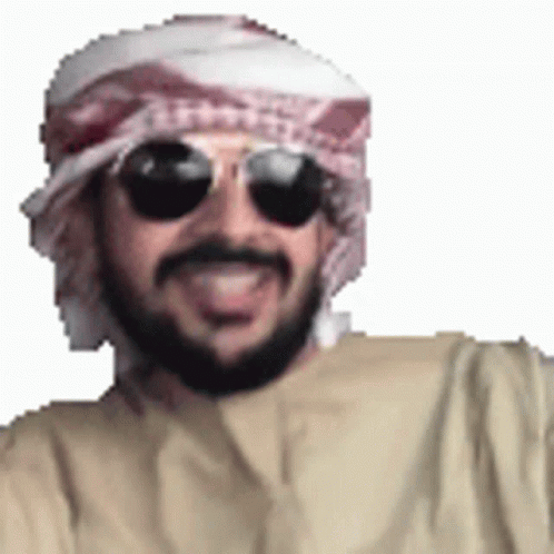 A Man With A Beard Wearing Sunglasses And A Scarf Around His Head . GIF
