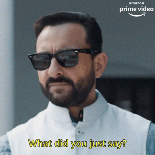 A Man With A Beard Wearing Sunglasses And A White Vest Says What Did You Just Say GIF