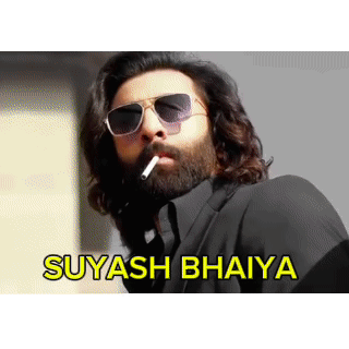 A Man With A Beard Wearing Sunglasses Is Smoking A Cigarette With The Words Suyasha Bhaiya Written Below Him GIF