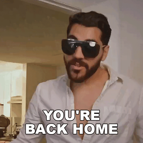 A Man With A Beard Wearing Sunglasses Says You 'Re Back Home GIF