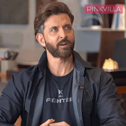 A Man With A Beard Wears A Black Shirt That Says Fighter GIF