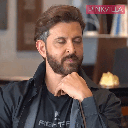 A Man With A Beard Wears A Black Shirt That Says Fighter GIF