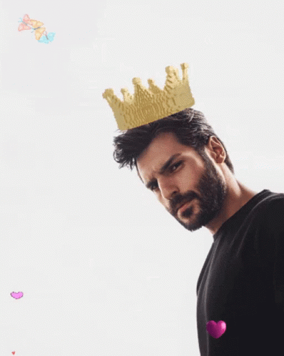 A Man With A Beard Wears A Gold Crown On His Head GIF
