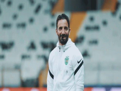 A Man With A Beard Wears A Nike Jacket GIF