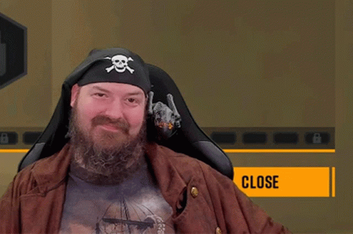 A Man With A Beard Wears A Pirate Hat And Holds A Bottle Of Beer GIF