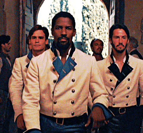 A Man With A Beard Wears A White Jacket With Buttons GIF