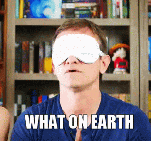 A Man With A Blindfold On His Eyes And The Words What On Earth Above Him GIF