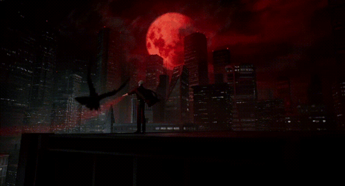 A Man With A Bloody Hand Is Reaching Out In The Dark GIF