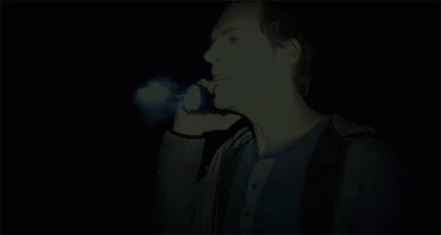 A Man With A Blue Light Coming Out Of His Face GIF