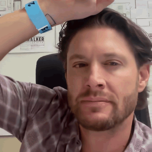 A Man With A Blue Wristband That Says Walker GIF