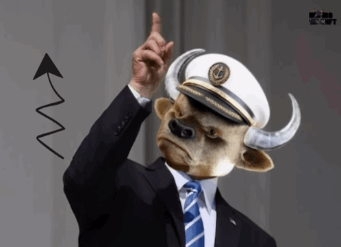 A Man With A Bull Head Wearing A Captain 'S Hat Points Up GIF