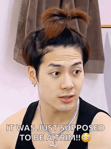 a man with a bun on his head and a necklace says it was just supposed to be a trim .