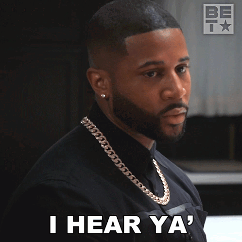 A Man With A Chain Around His Neck Is Saying I Hear Ya GIF