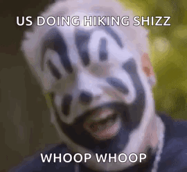 A Man With A Clown Face Painted On His Face Is Smiling . GIF