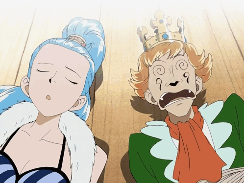 A Man With A Crown On His Head And A Woman Laying On The Floor GIF