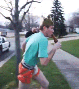 A Man With A Crown On His Head Is Drinking A Beer GIF