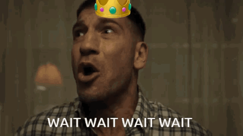 A Man With A Crown On His Head With The Words Wait Wait Wait Wait GIF
