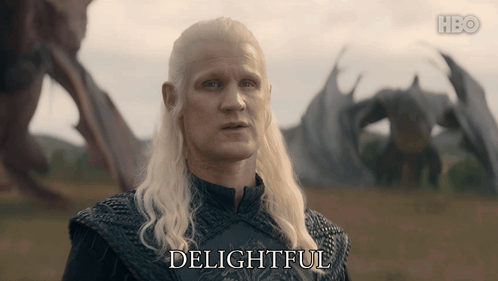 A Man With A Dragon In The Background Says " Delightful " GIF