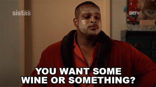A Man With A Face Mask Says " You Want Some Wine Or Something ? " GIF