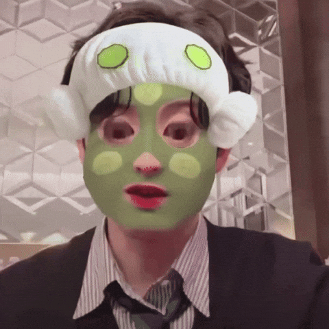 A Man With A Green Mask On His Face And A White Headband GIF