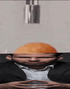 A Man With A Hard Hat On His Head Looks At Something GIF
