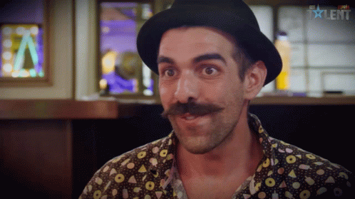 A Man With A Hat And A Mustache Is On A Tv Show Called Talent GIF