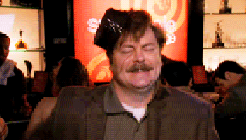 A Man With A Hat On His Head In Front Of A Sign That Says ' Sale ' GIF
