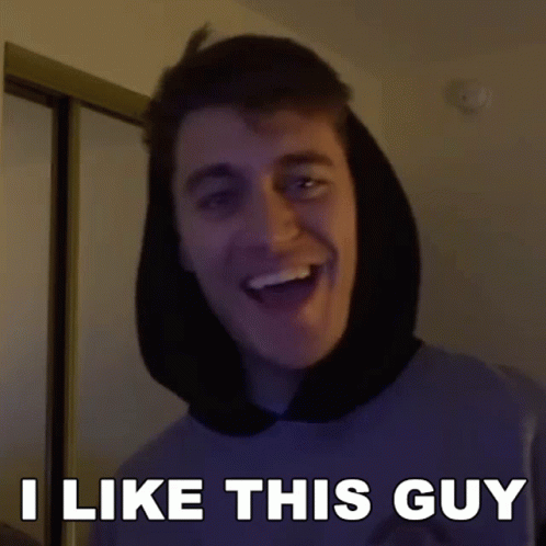 A Man With A Hood On His Head Is Smiling And Says I Like This Guy GIF