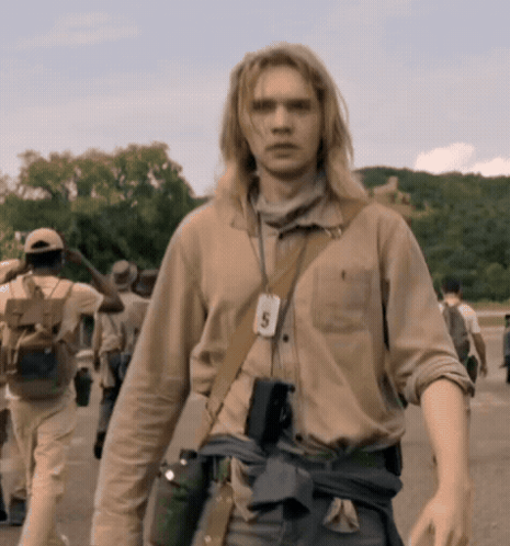 A Man With A Lanyard Around His Neck With The Number 5 GIF