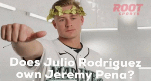 A Man With A Laurel Wreath On His Head Pointing At The Camera GIF