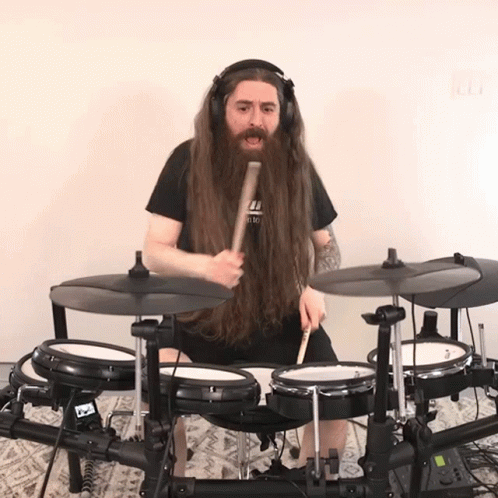 Man With Long Beard Playing Drums GIF