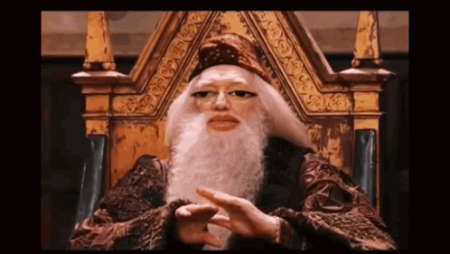 A Man With A Long Beard Is Sitting On A Throne GIF