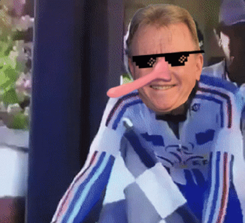 A Man With A Long Nose Wearing Sunglasses And A Blue Jacket GIF